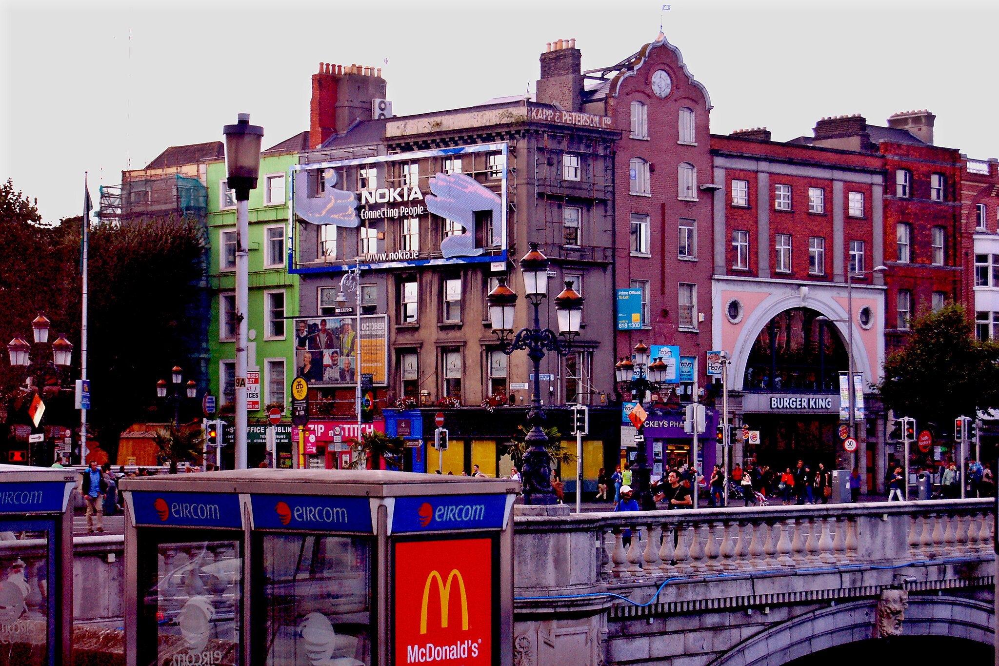 Houses in Dublin, Ireland, covered in adverts for tech companies.